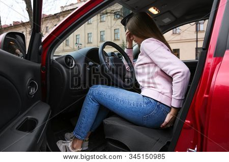 Woman Suffering From Hemorrhoid Pain In Car