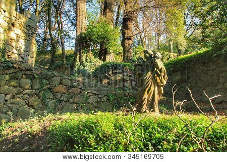 Oporto, Portugal- January 6, 2020: Stone Statue In The Idyllic Crystal Palace Garden In Oporto, Port