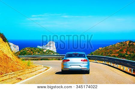 Car On Road At Porto Corallo Nebida Mediterranean Sea Sardinia Reflex
