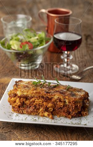 Greek Pastizio Noodle Dish With Cheese On Wood