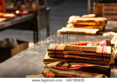 Yunlin, Taiwan - July 13th, 2019: chinese joss gold paper craft on a table at Beigang Chaotian Temple, Yunlin, Taiwan, Asia
