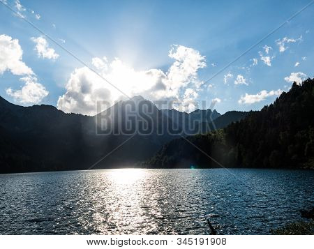 The Last Rays Of Sun On The Pond Of Sant Maurici, In The Aiguestortes And Sant Maurici National Park