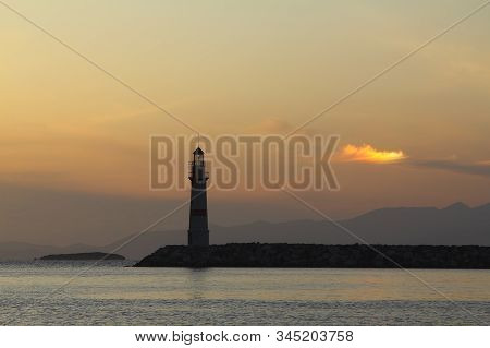 Seascape At Sunset. Lighthouse On The Coast. Seaside Town Of Turgutreis And Spectacular Sunsets