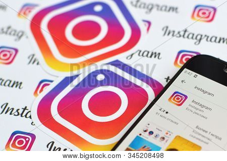 Instagram App On Samsung Smartphone Screen On Banner With Small Instagram Logos. Instagram Is Americ