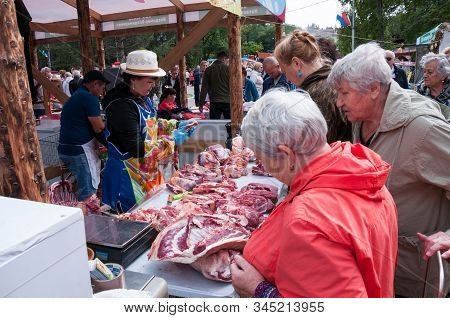 Russia, Khabarovsk, September 8, 2018: Harvest Festival, Pensioners Choose Meat