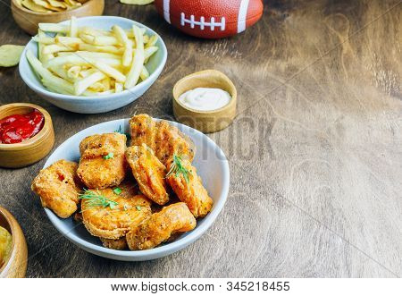 Table Fof Tasty Snacks And Beer Prepared For Watching Sports On Tv. Selective Focus
