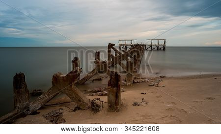 Dilapidated Old Fishing Dock Collapsing Into The Sea In Pak Nam Pran On The Gulf Of Thailand In Thai