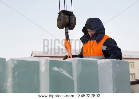 Portrait Of Installer At Unloading Ice Blocks