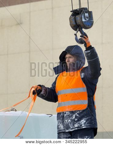 Portrait Of Installer At Unloading Ice Blocks