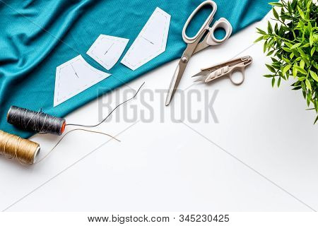 Sewing Wokrshop. Textile, Pattern, Scissors, Thread On White Background Top-down Copy Space