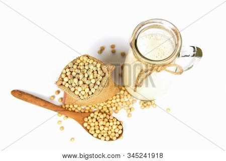 Soy Milk In Glass Jar For Healthy Diet And Natural Bean Protein / Soybean On Wooden Spoon And Dried 