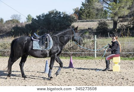 Riding Girl Are Training Her Black Horse