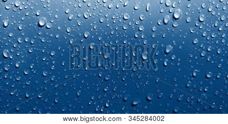 Water Drops On Blue Background. Close Up.selective Focus