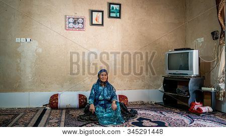 Shiraz, Iran - May 2019: Qashqai Turkish Woman Wearing A Traditional Dress In Her House