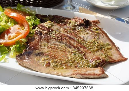 Tasty Seafood, Grilled Tuna Fish Steaks Served With Green Mojo Sauce On Outdoor Terrace On Puerto Na