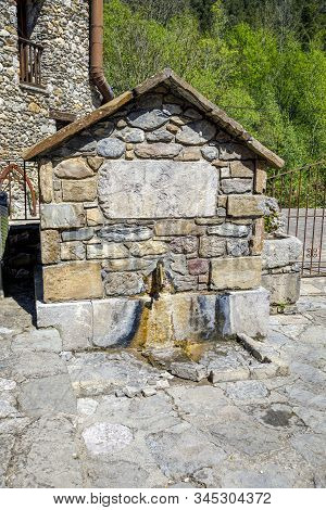 Old Water Fountain Next To The Church Of San Cristobal, Beget Spain