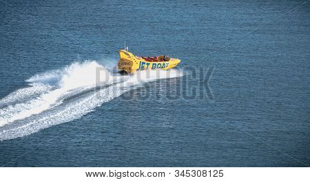Jetboat For Tourists Entering The Harbor Of Albufeira, Portugal