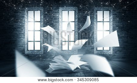 Open Book Magic. Dark Background Magic. An Open Book On A Wooden Table Under The Night Sky Against A