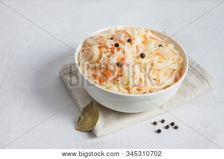 Homemade Sauerkraut. Fermented Food. Sauerkraut With Carrots In A White Bowl On A White Background C