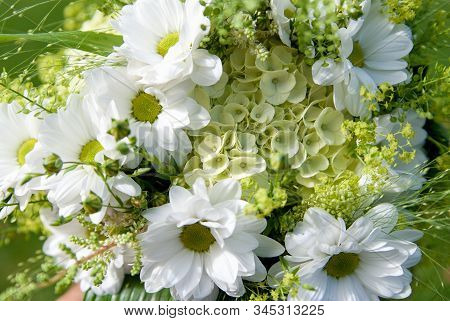 Detail Of The Wedding Bouquet Made From Field Flowers And Chrisanthemum