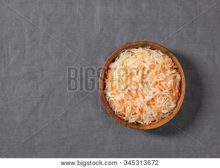 Homemade Sauerkraut. Fermented Food. Sauerkraut With Carrots In A Bowl On A Gray Background. Top Vie