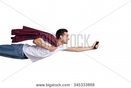 A Handsome Charming White Young Man In Blue Jeans, A White T-shirt With A Plaid Shirt On His Shoulde