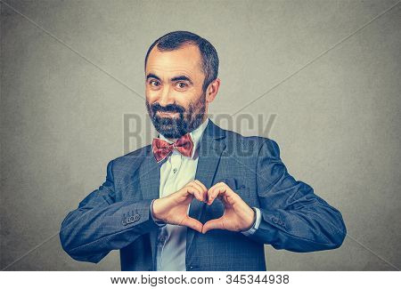Businessman Showing Heart Shape With Hands Looking At You Camera Smiling Happy. Love, Care Passion C