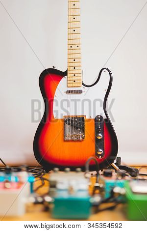 Electric Guitar And Effect Pedals In The Recording Studio. Concept Of Creating Guitar Music, Recordi