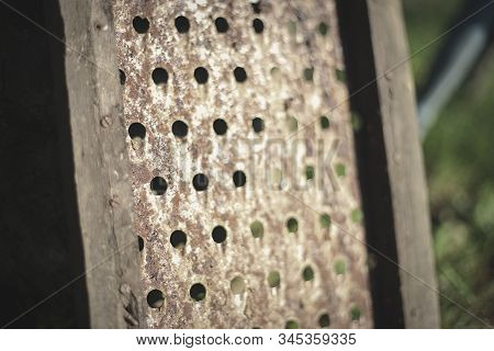 Close Up Of Old Metalic Grater For Fruits And Vegeatbles. Deatail Of Rusty Slicer With Wooden Frames
