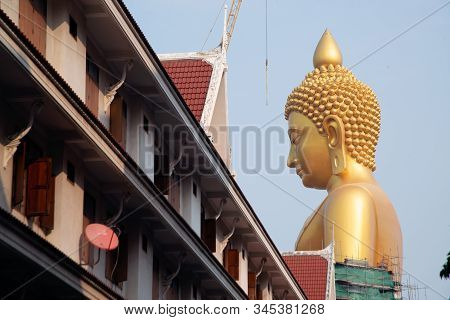 Bangkok , Thailand - January 13 , 2020 : The Large Outdoor Golden Sitting Buddha Is Phra Buddha Dham