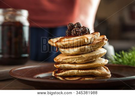 Siberian Dessert - Young Pine Cones Jam. Ukrainian Cone Jam In A Jar On A Dark Background Close-up A