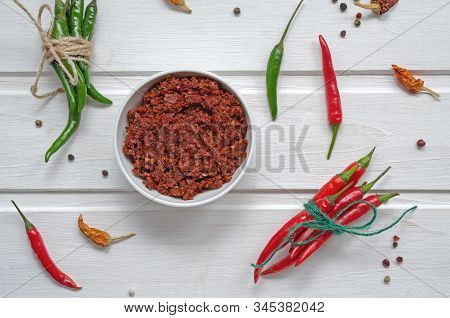 Spicy Chili On A Light Background, Flatlay. Used As An Ingredient For Harissa, Ajika, Muhammara. Eas