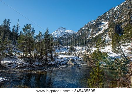 Small River In The Snowy Pyrenees Mountains, Near Pont Espagne