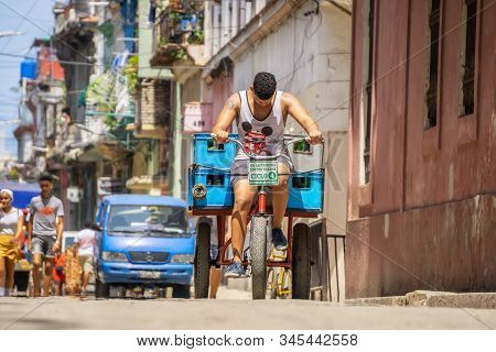 Havana, Cuba - May 16, 2019: Bicycle Taxi Driver In The Street Of Old Havana City During A Vibrant A