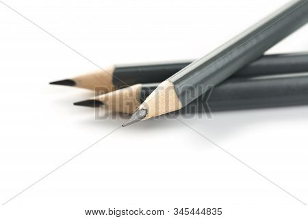 Three  Gray Triangular Pencil Isolated
On White Background