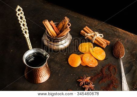 Turkish Coffee Maker And Ingredients On A Rustic Metal Table