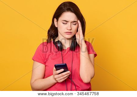 Close Up Portrait Of Woman With Cellphone Isolated Over Yellow Studio Background, Attarctive Female 