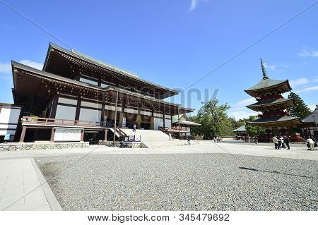 Narita, Japan - October 4, 2019: Tourist Walk Around Naritasan Temple With Red Pagoda In Naritasan S
