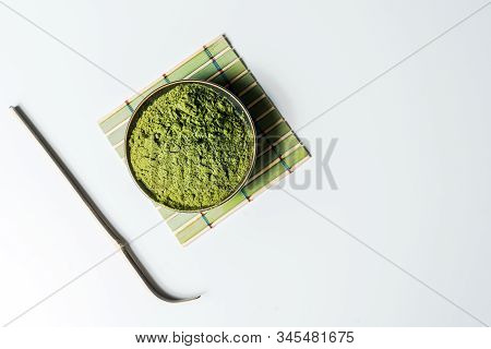 Matcha Green Tea Powder In A Bowl Isolated On White Background.