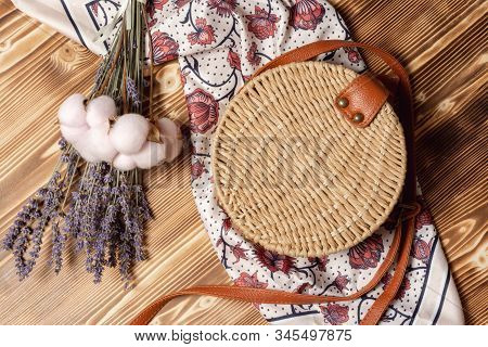 Round Straw Bag, Female Silk Scarf And Bouquet Of Lavender And Cotton Flowers. Spring Girl Fashion O