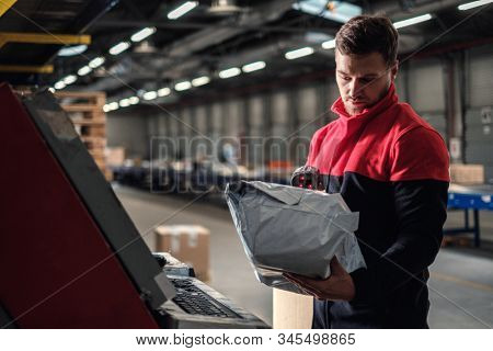 Courier picks up package on a warehouse