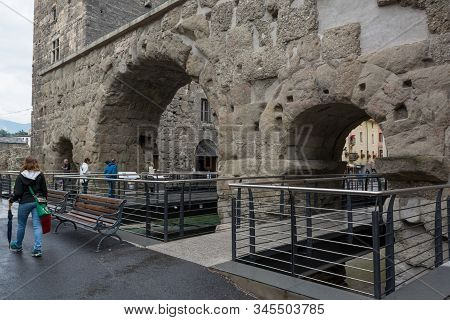 Aosta, Italy - July 20, 2014: Tourists Exploring Old Roman Ruins In Aosta