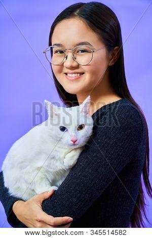 A Cat With A Different Eye Color, A Girl With Glasses Holds A White Cat, Bright Colours