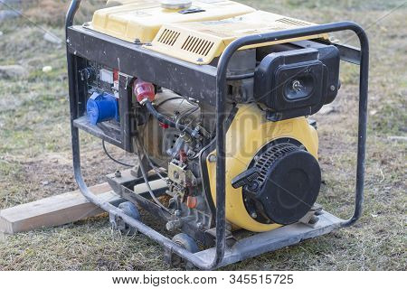 Close-up. Street Lighting. A Gasoline-powered Generator That Produces Current. Backup Or Emergency P