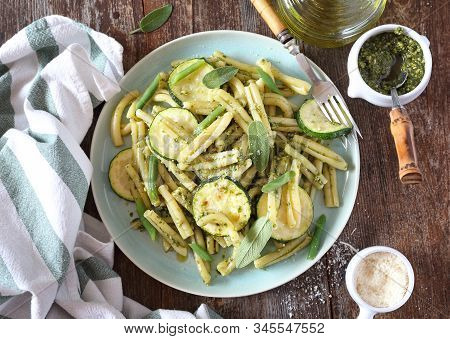 Italian Penne Pasta With Roasted Zucchini, Pesto Sauce And Green Beans, Olive Oil And Sage Dressing.
