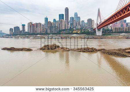 Chongqing, China - June 12, 2019 : Dongshuimen Bridge Above Yangtze River In Daylight With Yuzong Pe