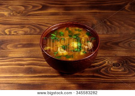 Kharcho Soup With Meat And Rice On Wooden Table