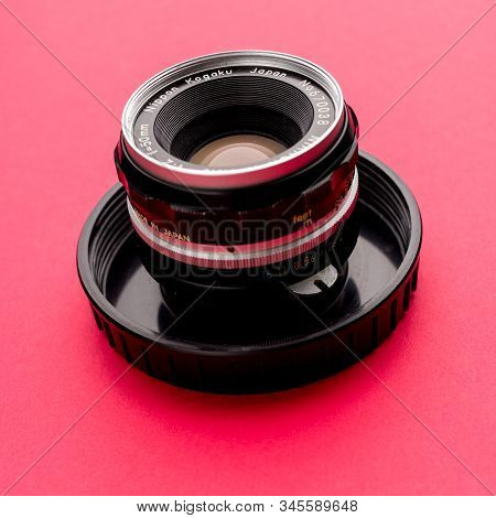 Tula, Russia - 16 December 2019: Vintage Nikon Lens On Red Background - Image