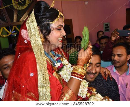 Midnapur, India - February 6, 2019: Indian Bride Hiding Her Face With Betel Leaf Also Called Paan. H