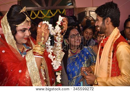 Midnapur, India - February 6, 2019: Indian Bengali Wedding Moment. Bride And Groom Exchanging Garlan